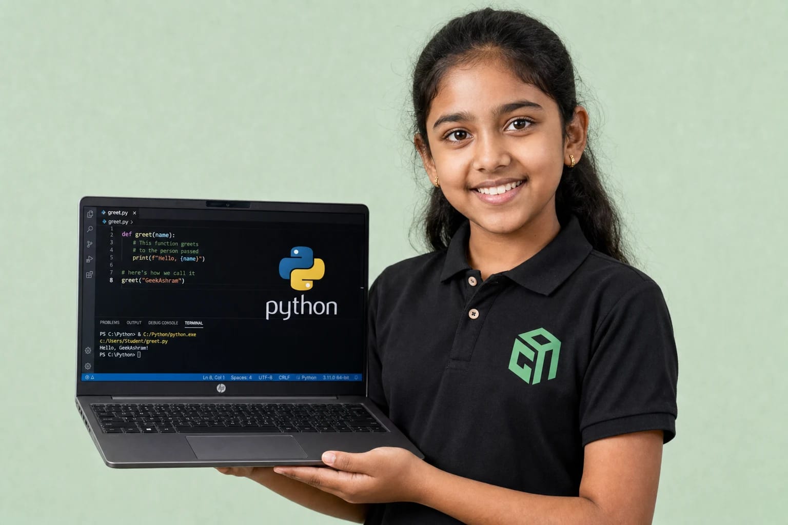 GeekashramJr student in black Geekashram polo learning Python programming and artificial intelligence